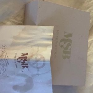 My Skin Buddy Facial Device, charger, stand and cotton round cover